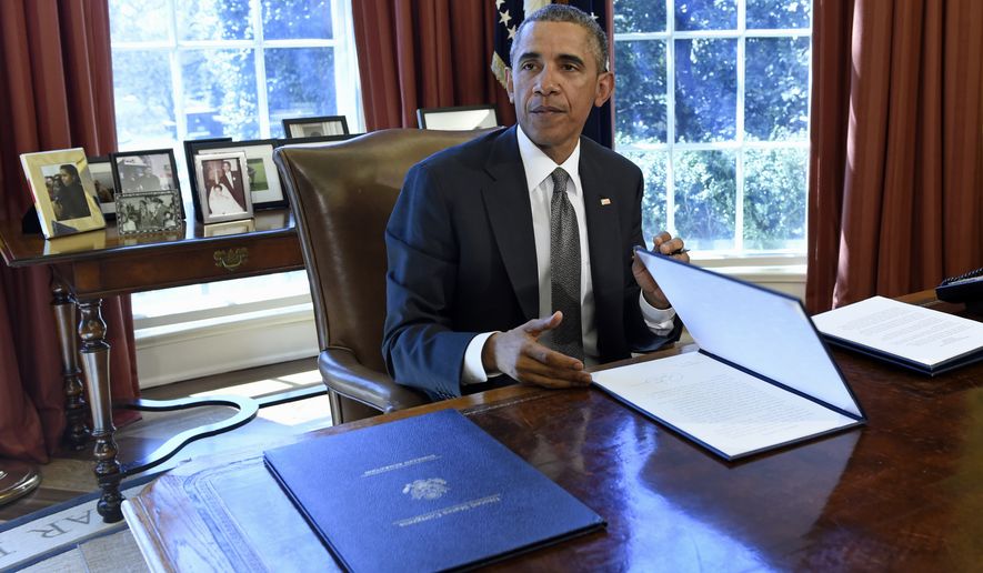 President Barack Obama speaks in the Oval Office of the White House in Washington, Tuesday, March 31, 2015, after signing a Memorandum of Disapproval Regarding S.J. Res. 8, a Joint Resolution providing for congressional disapproval of the rule submitted by the National Labor Relations Board relating to representation case procedures. (AP Photo/Susan Walsh)