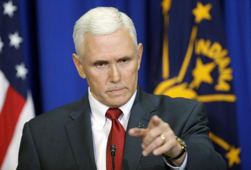 Indiana Gov. Mike Pence takes a question during a news conference, Tuesday, March 31, 2015, in Indianapolis. Pence said that he wants legislation on his desk by the end of the week to clarify that the state's new religious-freedom law does not allow discrimination against gays and lesbians. (AP Photo/Darron Cummings)