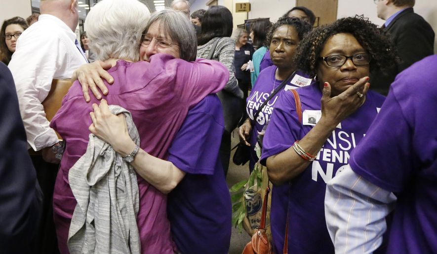 Supporters of Gov. Bill Haslam's Insure Tennessee proposal console one another after attending a meeting of the Senate Commerce Committee to hear debate on the measure Tuesday, March 31, 2015, in Nashville, Tenn. The proposal to extend health coverage to about 280,000 low-income Tennesseans was defeated 6-2. (AP Photo/Mark Humphrey)