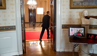 President Barack Obama walks through the Cross Hall of the White House before delivering a statement about the Supreme Court&#39;s ruling on the “Patient Protection and Affordable Care Act,” June 28, 2012. (Official White House Photo by Pete Souza)
 