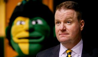 Dave Paulsen waits at the start of a news conference in Fairfax, Va., Wednesday, April 1, 2015, announcing him as the new George Mason men&#39;s basketball coach. Paulsen, who was a three-time Patriot League coach of the year at Bucknell University, replaces Paul Hewitt, who went 66-67 in four seasons at George Mason. (AP Photo/Andrew Harnik)