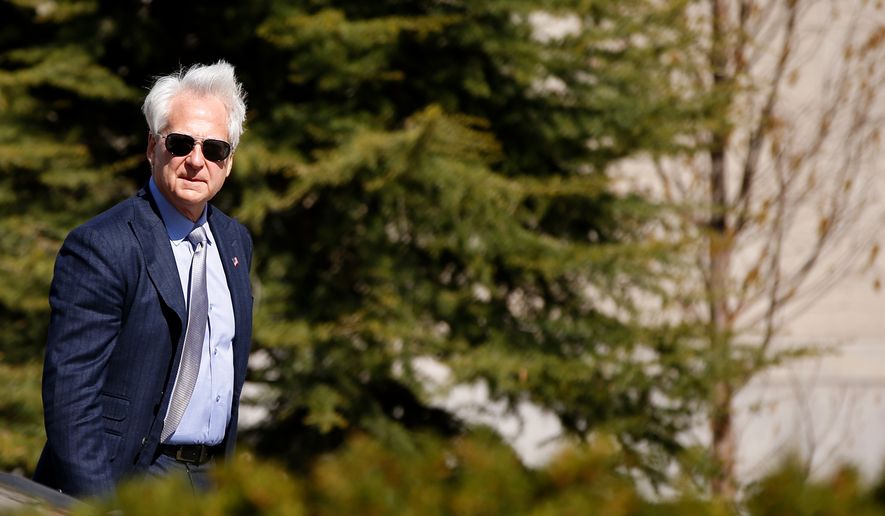 Freedom Watch attorney Larry Klayman leaves the Barrett Prettyman Federal Courthouse in Washington, Thursday, April 2, 2015, after a federal appeals court hearing in an appeal of the dismissal of a Freedom of Information Act (FOIA) request seeking records from the State Department about Israeli war plans and its cyber warfare techniques to New York Times reporter David Sanger when Hillary Rodham Clinton was secretary of state. Freedom Watch wants her private servers seized and to reopen the case. (AP Photo/Andrew Harnik)