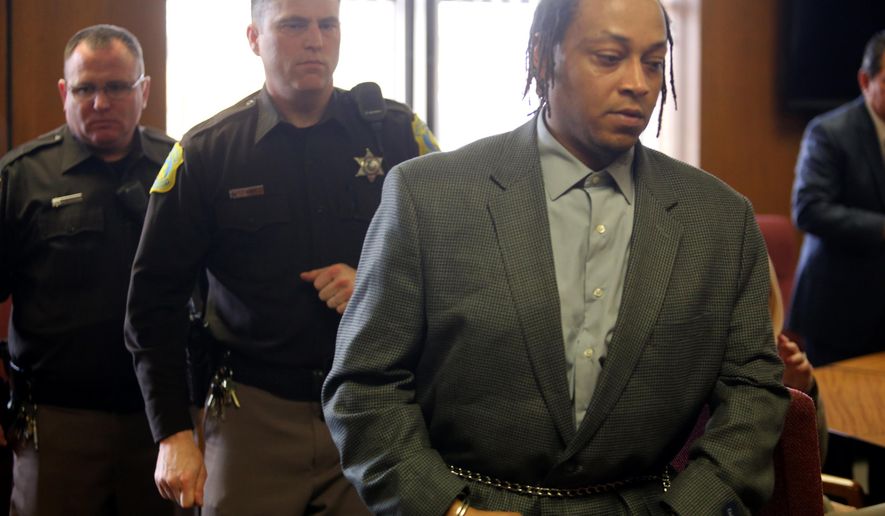 Brian Roberts, 40, right,was found guilty by a Kalamazoo County Circuit Court jury of first-degree murder and child abuse Thursday, April 2, 2015, in connection with his son's slaying. Nehemiah Dodd, 2 years old, died on Jan. 2, 2014. The Kalamazoo County Circuit Court jury deliberated about two hours before finding Brian K. Roberts guilty on all counts. (AP Photo/Kalamazoo Gazette-MLive Media Group, Mark Bugnaski) ALL LOCAL TELEVISION OUT; LOCAL TELEVISION INTERNET OUT