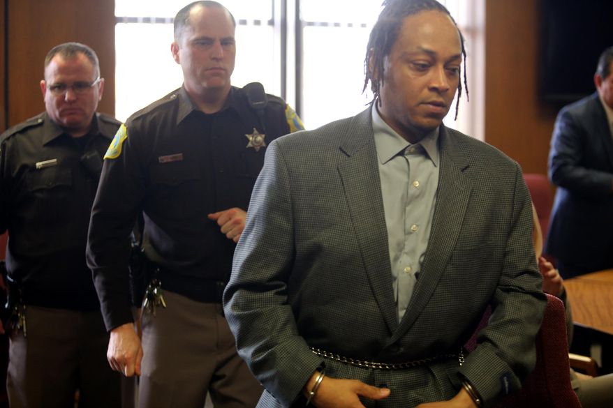 Brian Roberts, 40, right,was found guilty by a Kalamazoo County Circuit Court jury of first-degree murder and child abuse Thursday, April 2, 2015, in connection with his son's slaying. Nehemiah Dodd, 2 years old, died on Jan. 2, 2014. The Kalamazoo County Circuit Court jury deliberated about two hours before finding Brian K. Roberts guilty on all counts. (AP Photo/Kalamazoo Gazette-MLive Media Group, Mark Bugnaski) ALL LOCAL TELEVISION OUT; LOCAL TELEVISION INTERNET OUT