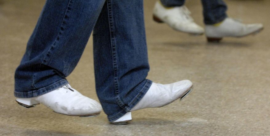 ADVANCE FOR USE SATURDAY, APRIL 4 AND THEREAFTER - In this Feb. 5, 2015 photo, champion clogger Stephen Auten leads the Sugar Creek Cloggers of Bloomington-Normal during practice at College Avenue Baptist Church in Normal, Ill. (AP Photo/The Pantagraph, Carlos T. Miranda)