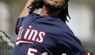 FILE - In this Tuesday March 3, 2015 file photo, Minnesota Twins starting pitcher Ervin Santana (54) throws batting practice at baseball spring training in Fort Myers, Fla. Minnesota Twins pitcher Ervin Santana has been suspended for 80 games by Major League Baseball after testing positive for the performance-enhancing substance Stanozolol. MLB announced the punishment Friday, April 3, 2015. (AP Photo/Tony Gutierrez, File)