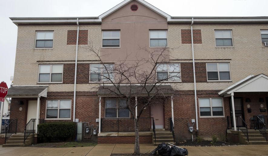 Shown is the home of a woman who is accused of trying to join and martyr herself for the Islamic State group in Syria, Friday, April 3, 2015, in Philadelphia. Thirty-year-old Keonna Thomas appeared in federal court Friday afternoon just hours after her arrest on a charge of attempting to provide material support and resources to a foreign terrorist organization. A prosecutor says a search warrant executed March 27 at Thomas' home prevented her from leaving the U.S. on a flight scheduled for March 29.(AP Photo/Matt Rourke)
