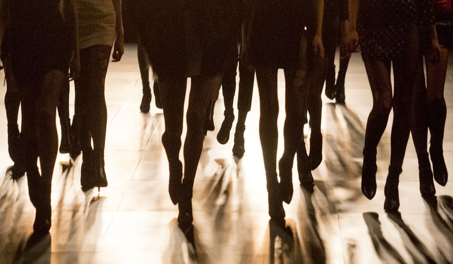 FILE- In this March 9, 2015 file photo, models wear creations for Saint Laurent's Fall/Winter 2015-2016 Ready to Wear fashion collection presented in Paris, as part of Paris Fashion Week. France’s lower house of Parliament has approved Friday April 3, 2015 a measure that would make it a crime to use anorexic models in advertising. (AP Photo/Jacques Brinon, File)