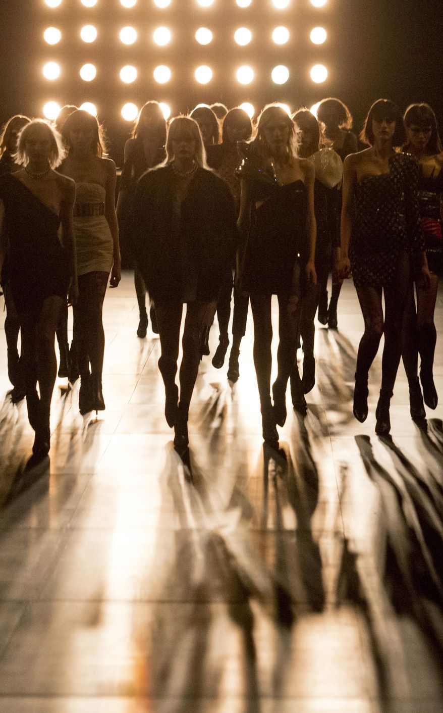 FILE- In this March 9, 2015 file photo, models wear creations for Saint Laurent's Fall/Winter 2015-2016 Ready to Wear fashion collection presented in Paris, as part of Paris Fashion Week. France’s lower house of Parliament has approved Friday April 3, 2015 a measure that would make it a crime to use anorexic models in advertising. (AP Photo/Jacques Brinon, File)
