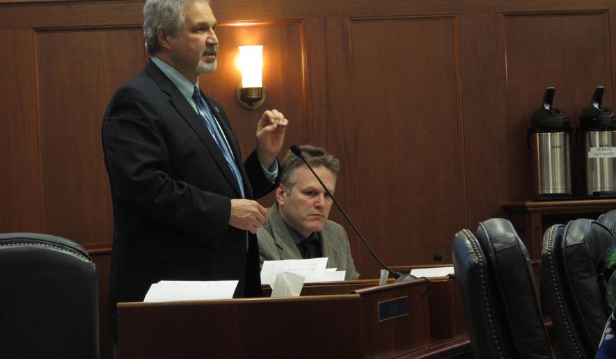 Senate Finance Committee co-chair Pete Kelly speaks on the floor of the Alaska Senate as lawmakers discussed the state operating budget on Friday, April 3, 2015, in Juneau, Alaska. (AP Photo/Becky Bohrer)
