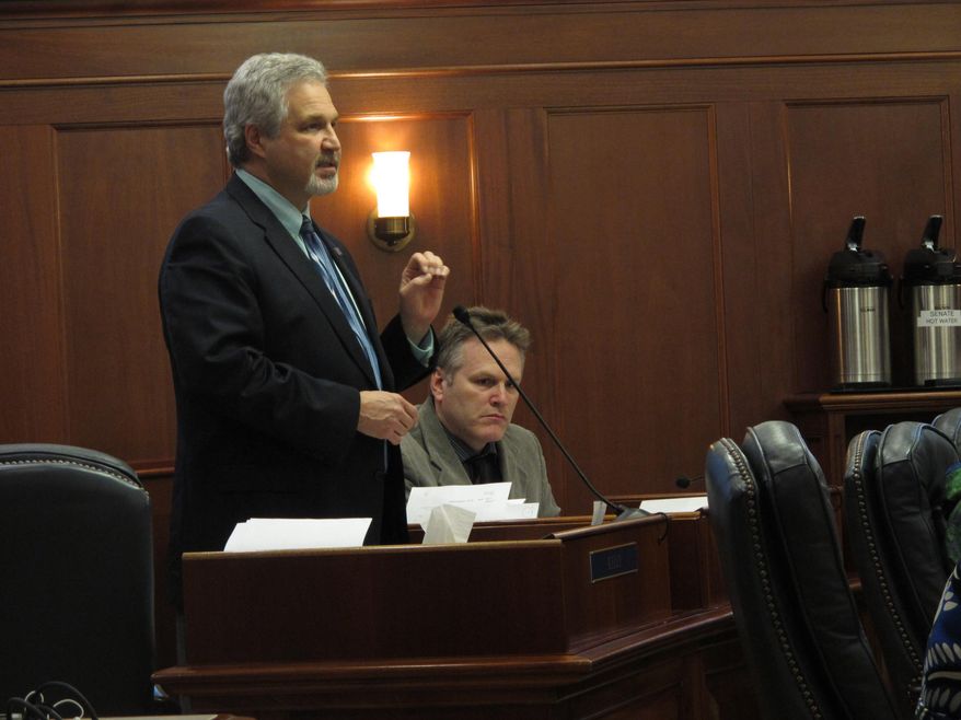 Senate Finance Committee co-chair Pete Kelly speaks on the floor of the Alaska Senate as lawmakers discussed the state operating budget on Friday, April 3, 2015, in Juneau, Alaska. (AP Photo/Becky Bohrer)