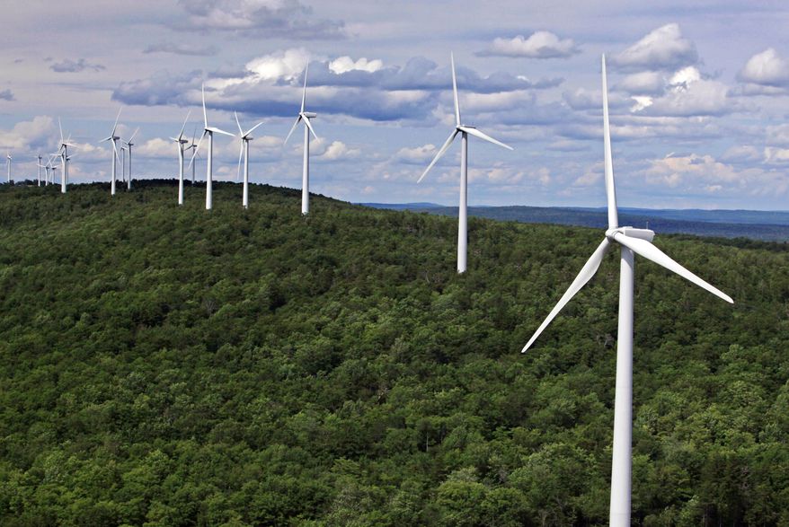 FILE- In this file photo made July 14, 2009, wind turbines line a ridge on Stetson Mountain in Stetson, Maine. The state became the regional wind power leader under Democratic Gov. John Baldacci, but change is in the air as Gov. Paul LePage makes an aggressive push away from his predecessor’s renewable energy policies. The outspoken Republican, who says wind power is too expensive, is looking to hydropower from Canada and natural gas to bring down electricity prices that are among the highest in the country. (AP Photo/Robert F. Bukaty, File)