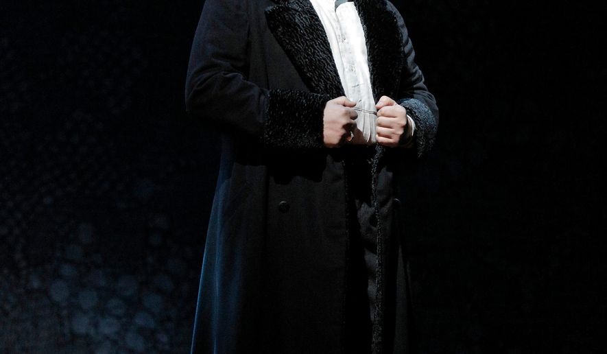 In this March 2015 photo provided by the Metropolitan Opera, Luca Salsi performs in the role of Enrico in Donizetti's "Lucia di Lammermoor" during a dress rehearsal at the Metropolitan Opera in New York. The 40-year-old baritone from Parma, Italy, was taking a walk with his wife Saturday, April 4, when he received a telephone call from Placido Domingo's son, who asked him if he could get to the Metropolitan Opera to take over as Don Carlo in a performance of Verdi's "Ernani." (AP Photo/Metropolitan Opera, Cory Weaver)