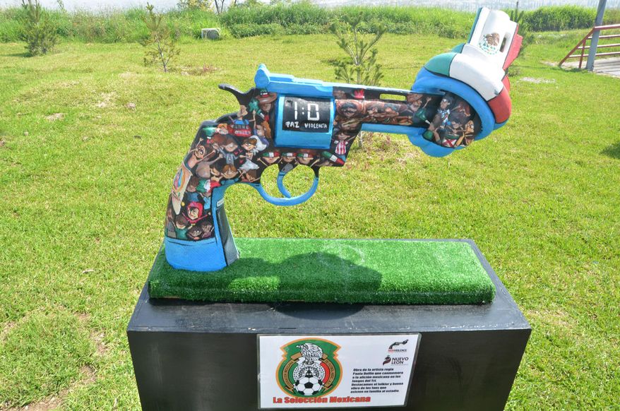 A knotted gun sculpture painted by Mexican artist Paola Delfin is displayed at a park in the city of Monterrey, Mexico, Thursday April 2, 2015. Thirteen knotted gun sculptures painted by various artists are on display in this city that for years has been plagued with violence generated by warring drug cartels. The original knotted gun sculpture was designed and created by Carl Fredrik Reutersward as a memorial to John Lennon after he was shot and killed in 1980 and is now displayed outside of the United Nations headquarters in New York City. (AP Photo/Emilio Vazquez)