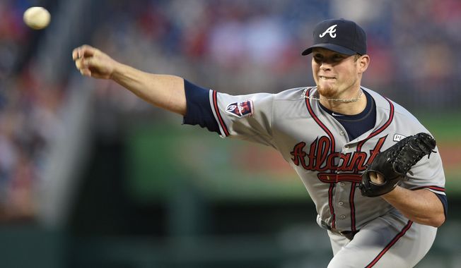FILE- In this Sept. 10, 2014, file photo, Atlanta Braves relief pitcher Craig Kimbrel delivers a pitch against the Washington Nationals during the ninth inning of a baseball game in Washington. In a trade announced Sunday, April 5, 2015, the San Diego Padres acquired Kimbrel and outfielder Melvin Upton from the Atlanta Braves for outfielders Carlos Quentin and Cameron Maybin, plus two minor leaguers and a draft pick. (AP Photo/Nick Wass, File)