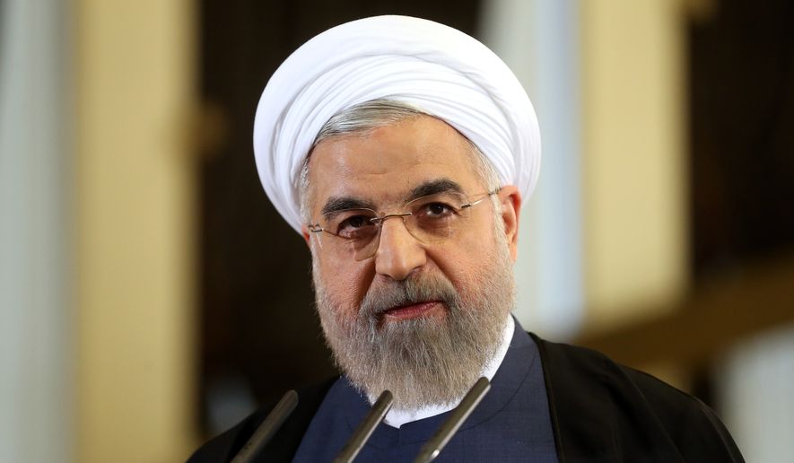 Iranian President Hassan Rouhani speaks in a news briefing at the Saadabad palace in Tehran in this Friday, April 3, 2015, file photo. (AP Photo/Ebrahim Noroozi, File)