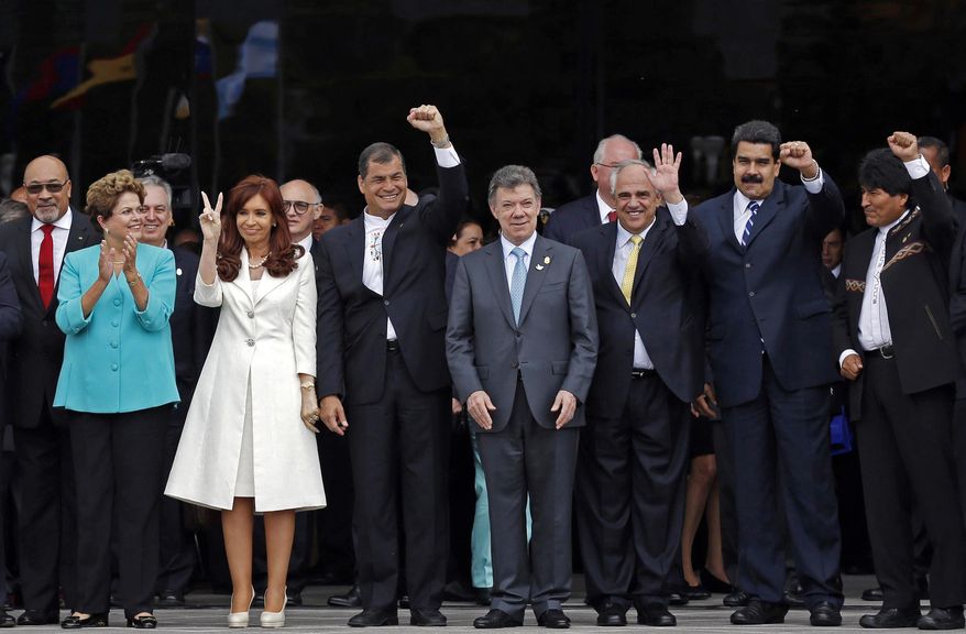 FILE - In this Dec. 5, 2014 file photo, UNASUR leaders pose for a group photo at the inauguration of the new UNASUR headquarters building in Quito, Ecuador. From left to right are Suriname's President Desi Bouterse, Brazil's President Dilma Rousseff, Argentina's President Cristina Fernandez, Ecuador's President Rafael Correa, Colombia's President Juan Manuel Santos, UNASUR General Secretary and former Colombian President Ernesto Samper, Venezuela's President Nicolas Maduro, and Bolivia's President Evo Morales. The South American regional bloc did attempt to mediate between the Venezuelan government and the opposition last year. But that effort fell through, and observers see those leaders as loath to try again. (AP Photo/Dolores Ochoa, File)
