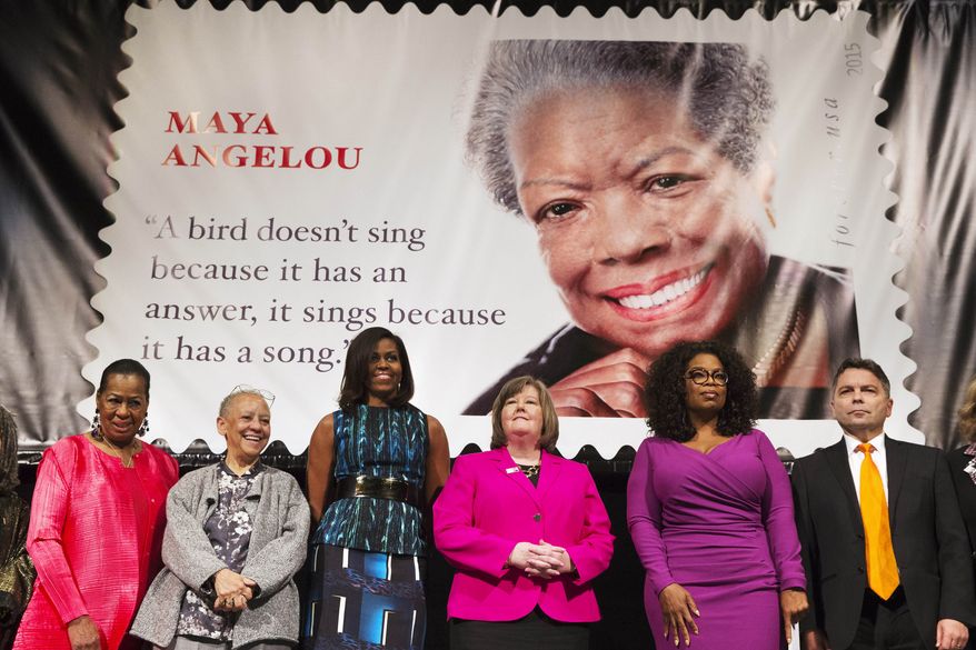 First lady Michelle Obama participates in the unveiling of the Maya Angelou Forever Stamp, Tuesday, April 7, 2015, at the Warner Theater in Washington. From left are, Eleanor Traylor, English Professor at Howard University; poet Nikki Giovanni; Mrs. Obama; Postmaster General Megan Brennan; Oprah Winfrey, and artist Ross Rossin. (AP Photo/Jacquelyn Martin)