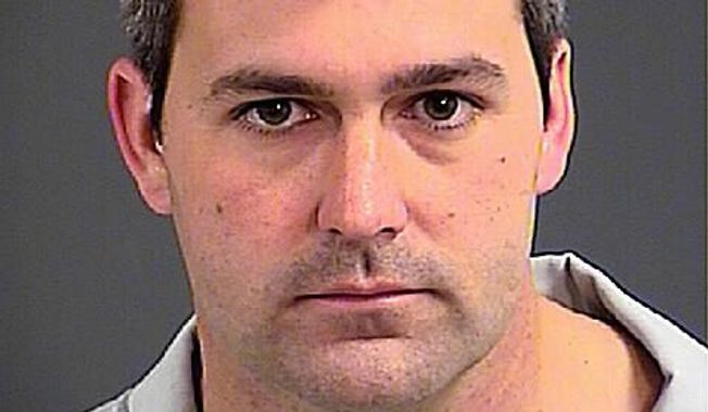 South Carolina police officer Michael Thomas Slager was charged with murder Tuesday, hours after law enforcement officials viewed a dramatic video that appears to show him shooting a fleeing man several times in the back. (Associated Press)