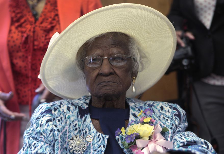 Jeralean Talley sits at the head table during a celebration of her 115th birthday at the New Jerusalem Missionary Baptist Church in Inkster, Michigan May 25, 2014. Talley, who turned 115 on Friday, is believed to be the oldest person in the United States and the second-oldest in the world, according to Gerentology Research Group, which validates ages of the world's longest living people. REUTERS/Rebecca Cook (UNITED STATES - Tags: SOCIETY) - RTR3QTKT