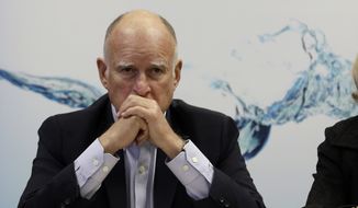California Gov. Jerry Brown waits for reporters after a three-hour meeting on the drought with agricultural, environmental and urban water agency leaders from across California, Wednesday, April 8, 2015, at his Capitol office in Sacramento. (AP Photo/Rich Pedroncelli)