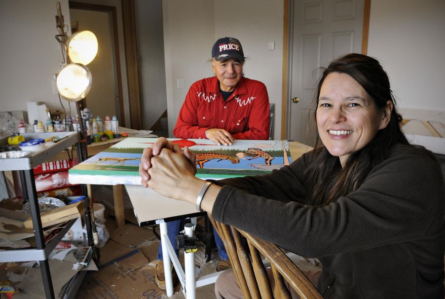 ADVANCED FOR RELEASE SATURDAY, APRIL 11, 2015 Native Skywatcher artists Annette Lee and her husband William Wilson create their paintings in their home studio near Foreston, Minn., Monday, March 30, 2015. Art, science and culture will combine in "Native Skywatchers — Earth Sky Connections," a series of 12 free art workshops and classes led by four artists with Native American heritage. (AP Photo/The St. Cloud Times, Jason Wachter)