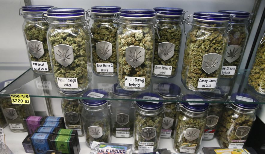 Marijuana and cannabis-infused products are displayed for sale at a marijuana dispensary in Denver, in this Dec. 27, 2013, file photo. (AP Photo/Brennan Linsley, file)