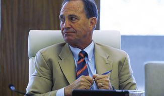 U.S. Rep. Ed Perlmutter, D-Colo., listens during a closed door meeting with representatives of the marijuana industry in Colorado, Thursday, April 9, 2015, in Denver. Perlmutter announced Monday that he would not seek reelection next year, further complicating his Democratic Party&#39;s endeavor to maintain their majority. (AP Photo/David Zalubowski)