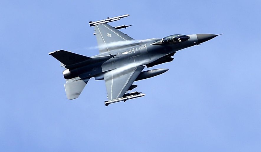 In this file photo taken Wednesday, April 8, 2015, a U.S. military fighter jet participates in a NATO Baltic Air Policing Mission practice mission in the Tapa training area, some 70 kilometers (43 miles) southwest of Tallinn, Estonia. Russia is so close that the F-16 fighter pilots can see it on the horizon as they swoop down over a training range in Estonia in the biggest ever show of U.S. air power in the Baltic countries. (AP Photo/Mindaugas Kulbis)