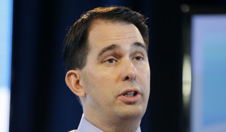 Wisconsin Gov. Scott Walker speaks during the Iowa Agriculture Summit in Des Moines, Iowa, on March 7, 2015. (Associated Press) **FILE**