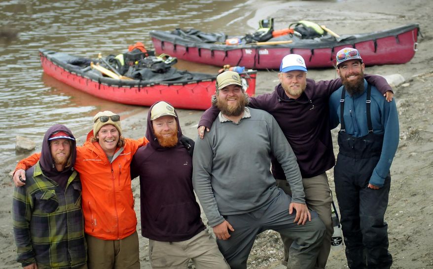 Four Minnesotans and a pair of Iowans made a brief stop in Mankato Wednesday before resuming their 5,200 mile canoe trip from the Gulf of Mexico to the Arctic Ocean. From left are Jarrad Moore, Luke Kimmes, Adam Trigg, John Keaveny, Dan Flynn and Winchell Delano. (AP Photo/Mankato Free Press, John Cross)