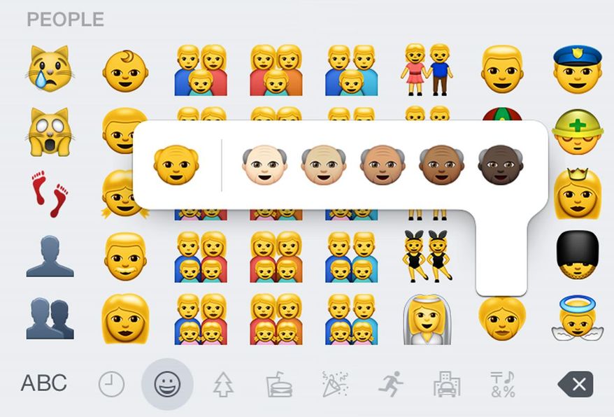 This screen shot made Thursday, April 9, 2015, on an iPhone 6 shows some of the new emojis available with the iOS 8.3 software update. The batch of more than 300 new emojis includes ones different skin tones and depictions of families with two moms or two dads. (AP Photo)