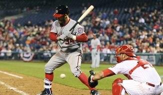 Washington Nationals&#39; Bryce Harper is called for a third strike during the eighth inning of a baseball game against the Philadelphia Phillies, Friday, April 10, 2015, in Philadelphia. The Phillies won 4-1. (AP Photo/Michael Perez)