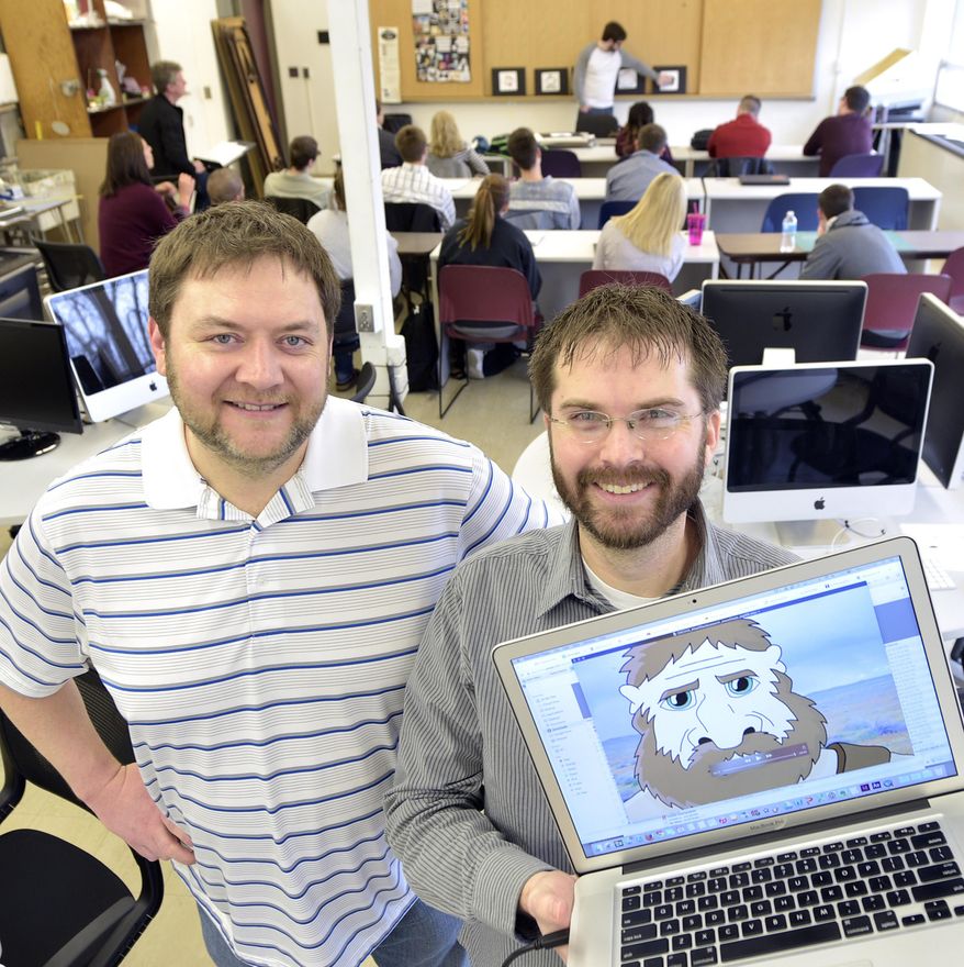 Morningside College professors, Dean Stevens, left, the chairman of the mathematical sciences department, and Rich Yates, assistant professor of graphical design, stand in an art classroom at the Sioux City college March 18, 2015. The two are working to introduce a new animation and video game development major to begin in the fall of 2015. (AP Photo/Sioux City Journal, Tim Hynds)