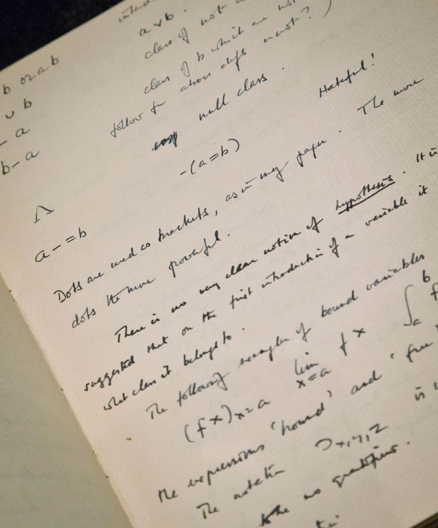 FILE - This Jan. 22, 2015 file photo, a page from the hand-written notebook by Alan Turing, the World War II code-breaking genius depicted by Benedict Cumberbatch in the Oscar-nominated &amp;quot;The Imitation Game,&amp;quot; is shown at Bonhams auction house in New York. The 56-page manuscript, containing Turing&#39;s complex mathematical and computer science notations, is being sold by Bonhams in New York on Monday, April 13. (AP Photo/Bebeto Matthews, File)