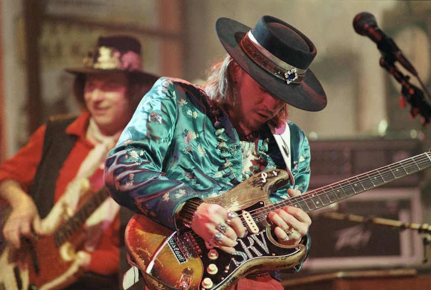 FILE- In this Feb. 13, 1986, file photo, guitarist Stevie Ray Vaughan rehearses with his band Double Trouble for a performance on Saturday Night Live in New York. Stevie Ray Vaughan, a six-time Grammy winner, was killed in a 1990 helicopter crash at the age of 35. Plans are in the works in Dallas for an art piece honoring blues guitarist brothers Stevie Ray and Jimmie Vaughan at a park located just blocks from the home where they grew up in Dallas. (AP Photo/Marty Lederhandler, File)