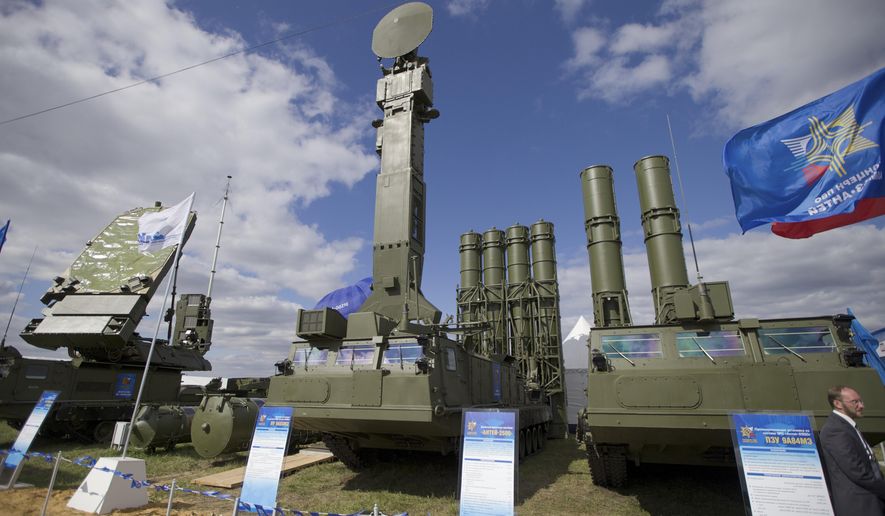 FILE - In this file photo taken on Tuesday, Aug. 27, 2013 a Russian air defense missile system Antey 2500, or S-300 VM, is on display at the opening of the MAKS Air Show in Zhukovsky outside Moscow. Russia has supplied similar systems to Syria. The Kremlin says Russia has lifted its ban on the delivery of a sophisticated air defense missile system to Iran. Russia signed the $800 million contract to sell Iran the S-300 missile system in 2007, but later suspended their delivery because of strong objections from the United States and Israel. The decree signed Monday, April 13, 2015, by President Vladimir Putin allows for the delivery of the missiles. (AP Photo/Ivan Sekretarev, File)