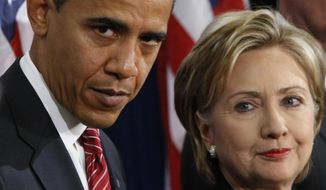 In this Dec. 1, 2008, file photo, then-President-elect Barack Obama, left, stands with then-Sen. Hillary Rodham Clinton, D-N.Y., after announcing that she is his choice as Secretary of State during a news conference in Chicago. (AP Photo/Pablo Martinez Monsivais, File)