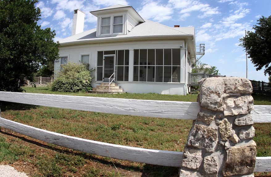 FILE - In this April 27, 2012 file photo, the Reynold's house is seen at Fort Hood, Texas. Crews have begun tearing down the only surviving Fort Hood building to predate the Central Texas post. Demolition began Tuesday, April 14, 2015, on the historic Reynolds House. A Fort Hood statement says a lengthy process determined the building was unsafe and too costly to repair.(Marianne Lijewski/Killeen Daily Herald via AP, File)