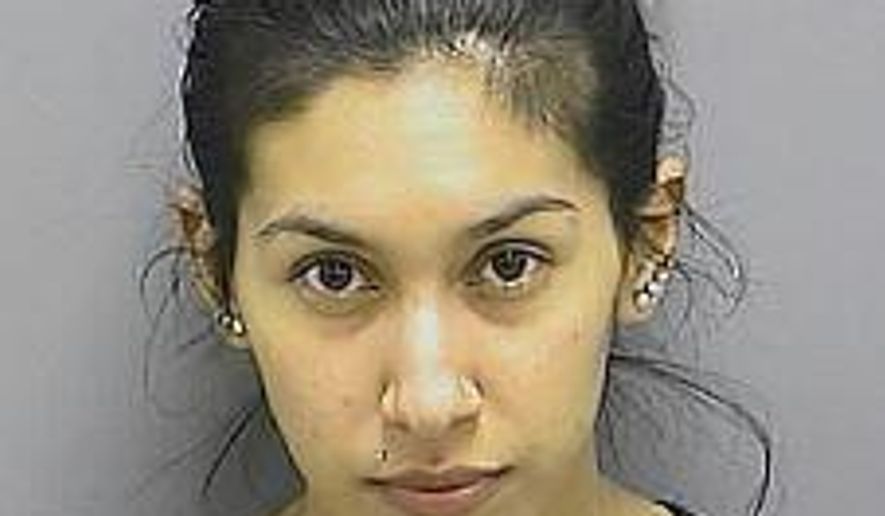 This handout photo provided by the Frederick, Md., Sheriff’s Office, taken March 17, 2014, shows Stephanie Ramirez Williams. A judge in Frederick, Md. has sentenced a woman to 20 years in prison for failing to prevent her husband from killing their 21-month-old daughter Anayah in a case that prompted state child-welfare reform legislation. Stephanie Williams was sentenced Tuesday. She was convicted last week in a plea deal of first-degree child abuse resulting in death. (Joseph Hayer, Frederick County, Md., Sheriff’s Office via AP)