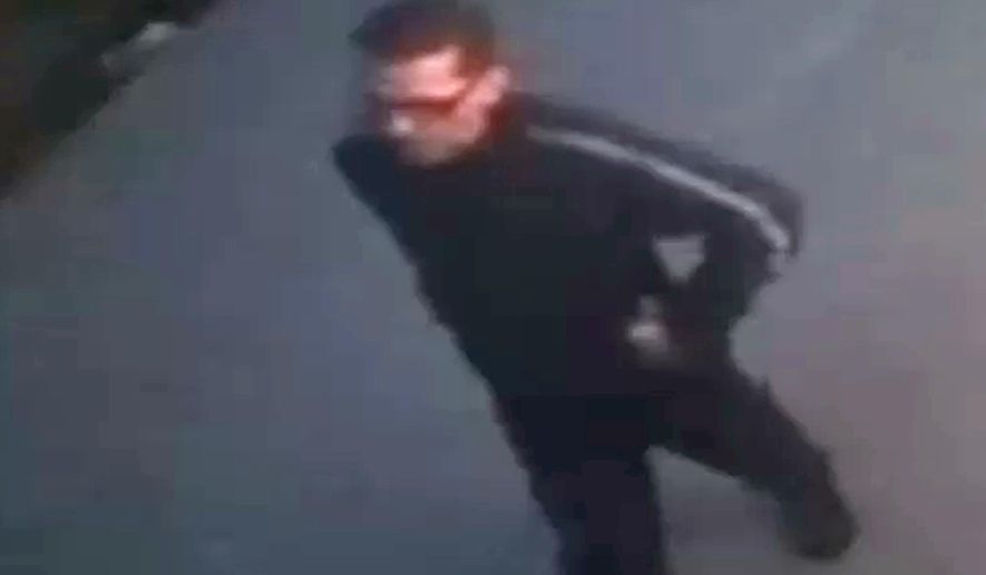In this image from a surveillance video provided by the New York Police Department, a suspect is seen walking near a New York sports bar, Saturday, April 11, 2015. The suspect walked into the basement bathroom of the Turnmill Bar on East 27th Street on Saturday and hid inside a stall, police said. He allegedly then grabbed the 23-year-old woman, pulled her into a stall and raped her. (New York Police Department via AP)