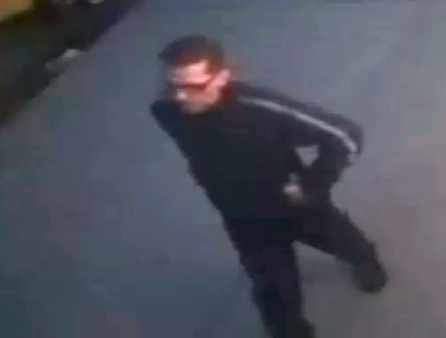 In this image from a surveillance video provided by the New York Police Department, a suspect is seen walking near a New York sports bar, Saturday, April 11, 2015. The suspect walked into the basement bathroom of the Turnmill Bar on East 27th Street on Saturday and hid inside a stall, police said. He allegedly then grabbed the 23-year-old woman, pulled her into a stall and raped her. (New York Police Department via AP)