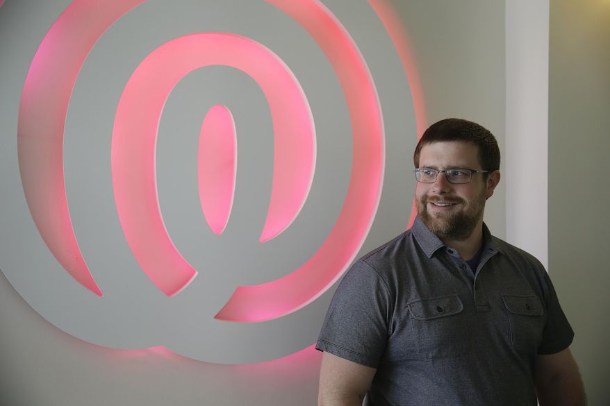 Life360 co-founder and president Alex Haro poses at his company headquarters in San Francisco, Tuesday, April 14, 2015 The same week that Haro and Chris Hulls raised $50 million for their mobile app, Life360, the two business partners got a letter. It said they had three days to pay licensing fees to a company they had never heard of because their app violated patented technology. Haro and Hulls traced the company, Advanced Ground Information Systems, to a residential address in Jupiter, Florida, with a phone number that went to an anonymous voicemail. They couldn’t find any employees on LinkedIn. (AP Photo/Eric Risberg)
