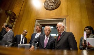 Senate Foreign Relations Committee Chairman Sen. Bob Corker, R-Tenn., center, speaks with the committee&#39;s ranking member Sen. Ben Cardin, D-Md., on Capitol Hill in Washington, Tuesday, April 14, 2015, as they arrive for a committee&#39;s meeting to debate and vote on the Iran Nuclear Agreement Review Act of 2015. Republican and Democrats on the Senate Foreign Relations Committee reached a compromise Tuesday on a bill that would give Congress a say on an emerging deal to curb Iran&#39;s nuclear program. Also pictured is Sen. Jeff Flake, R-Ariz., third from left. (AP Photo/Andrew Harnik)