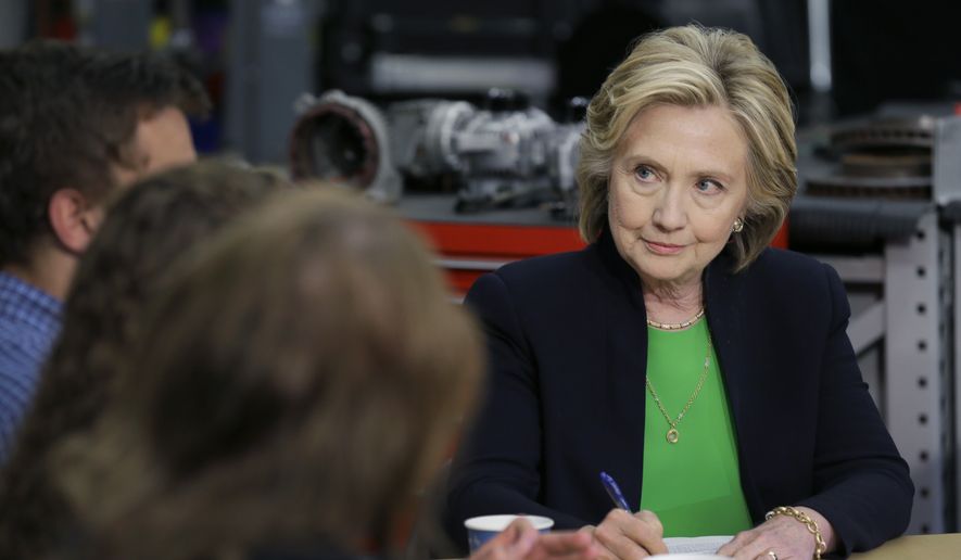 Democratic presidential candidate Hillary Rodham Clinton takes notes during a roundtable with educators and students at the Kirkwood Community College&#x27;s Jones County Regional Center, Tuesday, April 14, 2015, in Monticello, Iowa. (AP Photo/Charlie Neibergall)