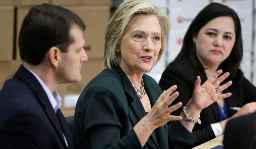 Democratic presidential candidate Hillary Rodham Clinton held a small-business roundtable Wednesday in Des Moines, Iowa, as part of her effort to show her more personal side, even as she eased away from President Obama&#39;s policies. (Associated Press) ** FILE **