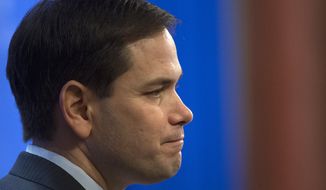 Republican presidential candidate Sen. Marco Rubio, R-Fla., discusses their recently released tax reform plan, Wednesday, April 15, 2015, at the  Heritage Foundation in Washington. (AP Photo/Molly Riley)