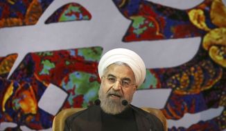 FILE - In this Sunday, April 12, 2015 file photo, Iranian President Hassan Rouhani speaks at a ceremony to commemorate the late Khadijeh Saghafi, wife of late revolutionary founder Ayatollah Khomeini, in Tehran, Iran. Rouhani has dismissed pressure from the U.S. Congress over a preliminary deal on Iran&#39;s nuclear program, saying that Tehran is dealing with world powers not American lawmakers. (AP Photo/Vahid Salemi, File)