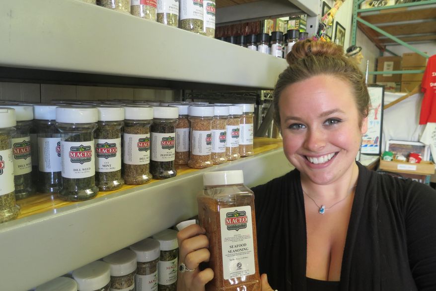 Concetta Maceo, who manages the family business, moved back to Galveston last year to go to nursing school but realized that spices were her passion. (Joe Holley/Houston Chronicle via AP)