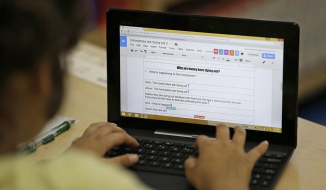 In this Thursday, March 12, 2015, photo, a fourth-grader uses Google docs to complete an exercise at Mira Vista School in Richmond, Calif. (AP Photo/Eric Risberg) ** FILE **